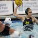 Michigan junior Kelsey Nolan elevates to pass in the game against Indiana on Saturday, April 27. Daniel Brenner I AnnArbor.com